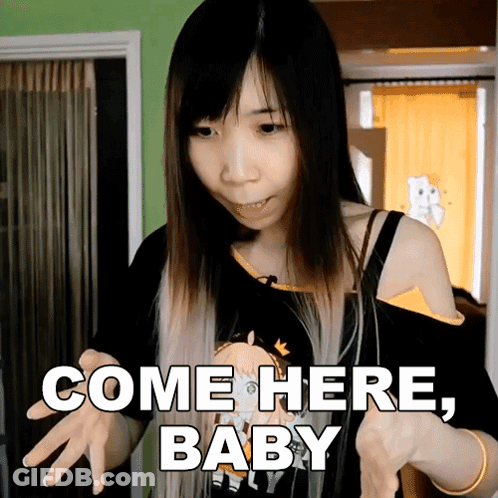 Woman Holding Doll Saying Come Here Baby GIF