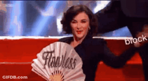 Woman Holding Fan Saying Fearless GIF