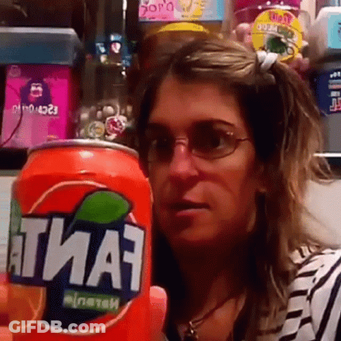 Woman Holding Fanta Can In Front Of Face GIF