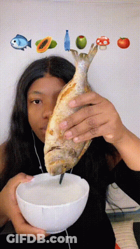 Woman Holding Fish And Bowl Of Food GIF