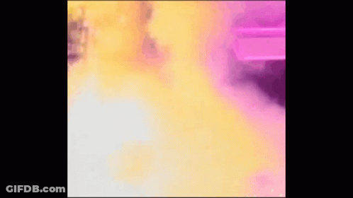 Woman Holding Flag In Front Of Explosion GIF