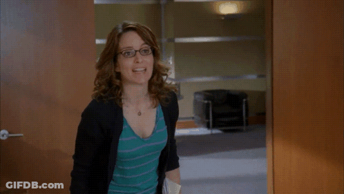 Woman Holding Folder In Front Of Phillies Sign GIF