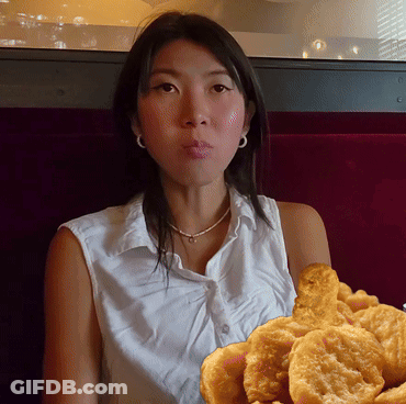 Woman Holding Fried Food GIF