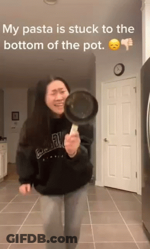 Woman Holding Frying Pan Making Funny Face GIF