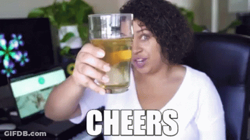 Woman Holding Glass Of Beer Saying Cheers GIF
