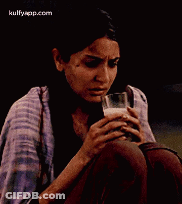 Woman Holding Glass Of Milk GIF