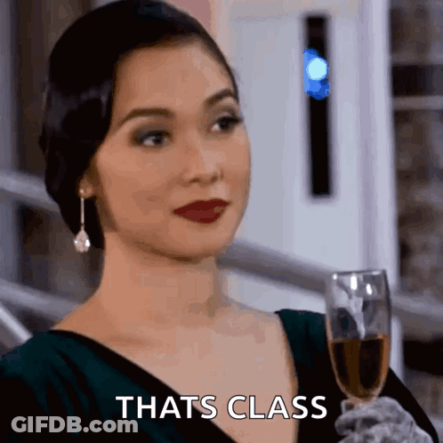 Woman Holding Glass Of Wine Saying Cheers GIF