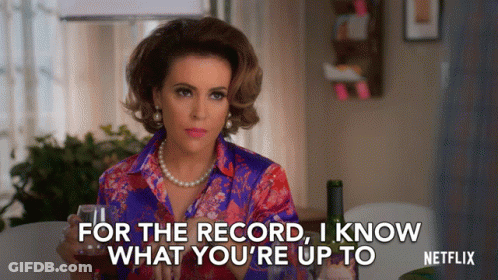 Woman Holding Glass Of Wine Says For The Record I Know What You're Up To Netflix GIF