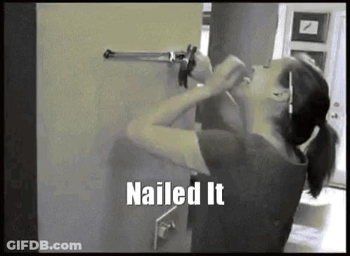 Woman Holding Gun Against Wall Saying Nailed It GIF