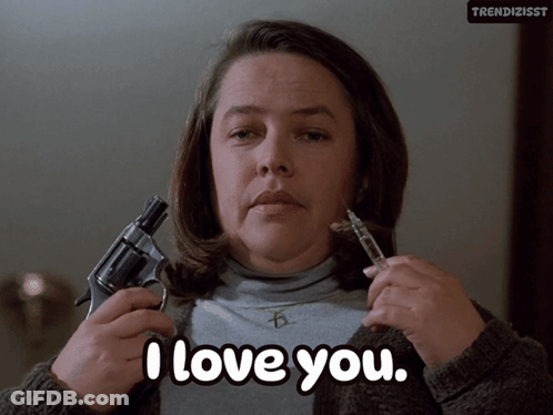 Woman Holding Gun And Syringe Saying I Love You GIF