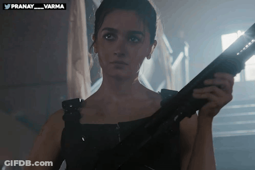 Woman Holding Gun At Pranay Sign GIF