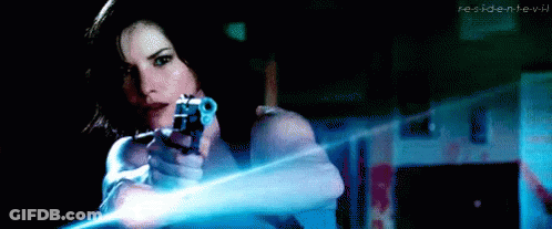 Woman Holding Gun In Dark Room Resident Evil GIF