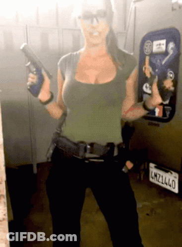Woman Holding Gun In Front Of License Plate LMZ1L40 GIF