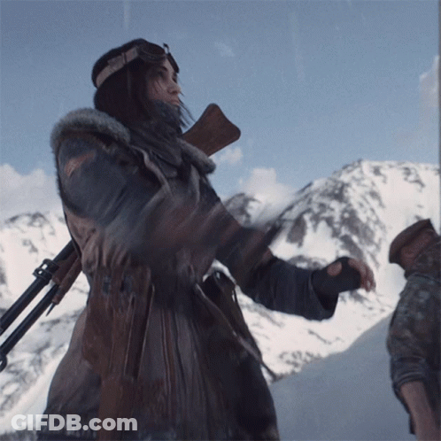 Woman Holding Gun In Front Of Mountain GIF