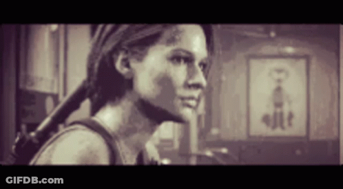 Woman Holding Gun In Room GIF