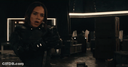 Woman Holding Gun Saying Who Are You GIF