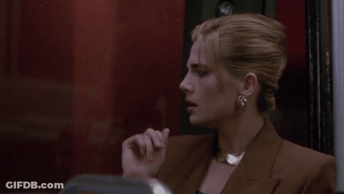 Woman Holding Hand To Forehead With Ring GIF