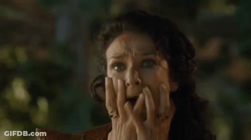 Woman Holding Hands To Face Making Funny Face GIF