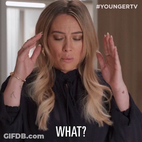 Woman Holding Head And Saying What GIF
