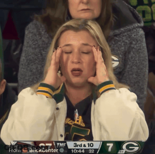 Woman Holding Head In Front Of 3Rd & 10 Scoreboard GIF