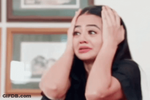 Woman Holding Head Making Funny Face GIF
