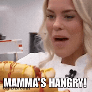 Woman Holding Hot Dogs Saying Mamma's Hangry GIF