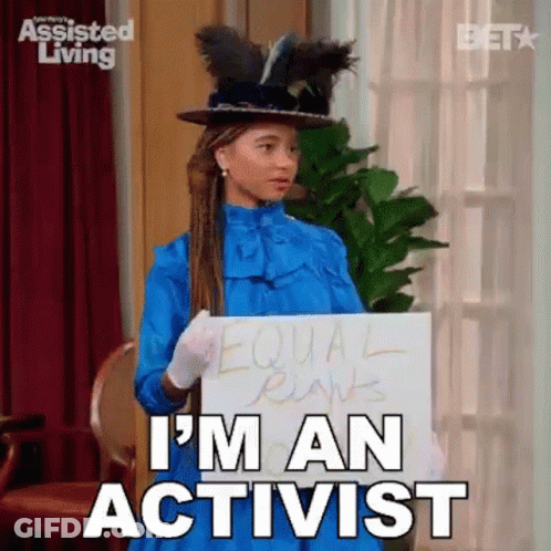 Woman Holding I'm An Activist Sign In Blue Dress And Hat GIF
