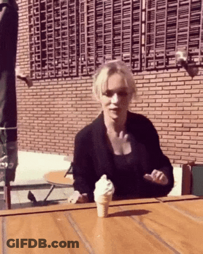 Woman Holding Ice Cream Cone GIF