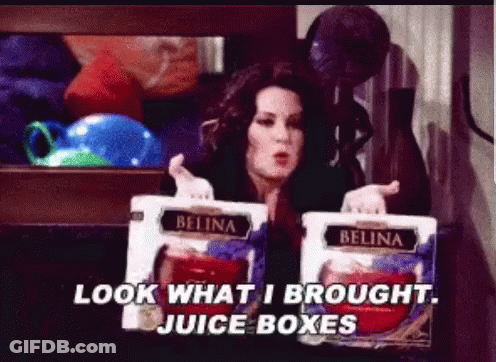 Woman Holding Juice Boxes Saying Look What I Brought GIF
