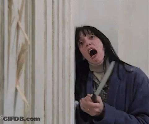 Woman Holding Knife In Front Of Door GIF