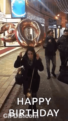 Woman Holding Large Balloon And Sparkler GIF