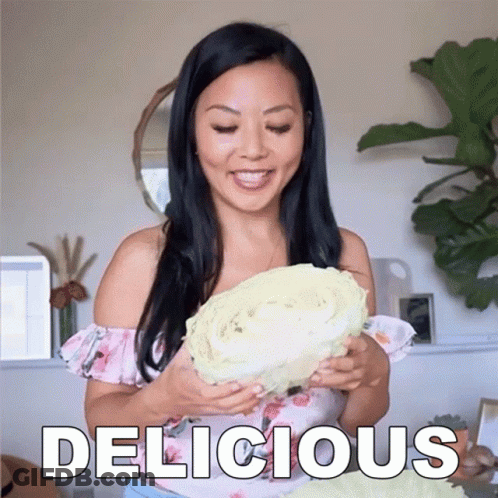 Woman Holding Large Cabbage Saying Delicious GIF