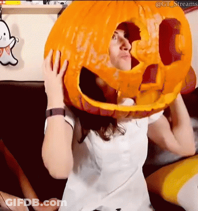 Woman Holding Large Pumpkin On Head GIF
