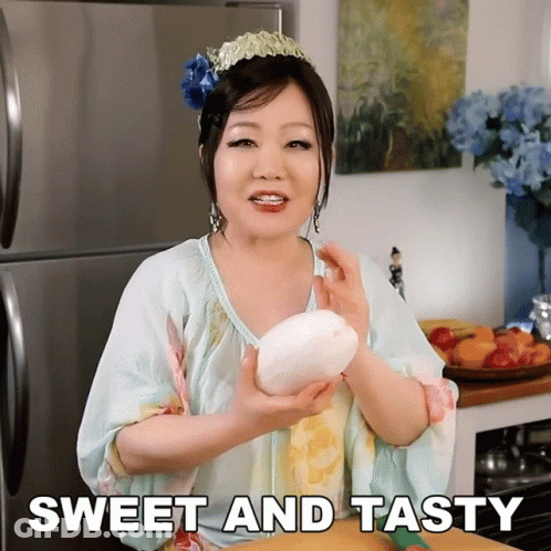 Woman Holding Large White Object Sweet And Tasty GIF
