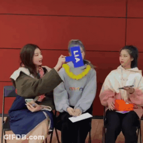 Woman Holding Lia Sign GIF
