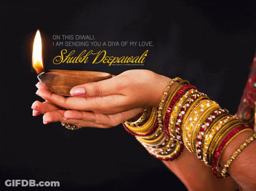 Woman Holding Lit Candle With Shubh Deepawali Message GIF