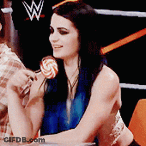 Woman Holding Lollipop In Front Of Wrestling Ring GIF