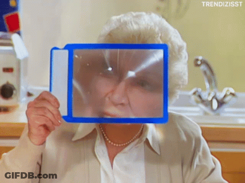 Woman Holding Magnifying Glass GIF