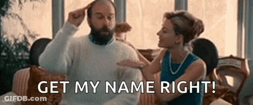 Woman Holding Man's Head On Couch GIF