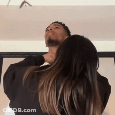 Woman Holding Man's Neck Looking Up GIF