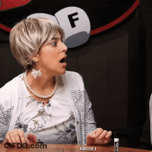 Woman Holding Marker Beside Sign Letter F GIF
