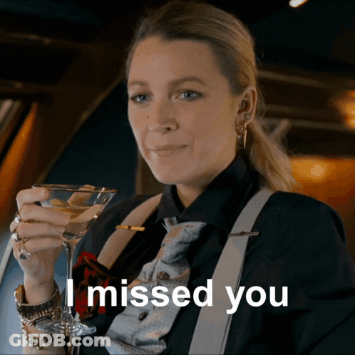 Woman Holding Martini Glass Saying I Missed You GIF