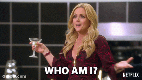 Woman Holding Martini Glass Saying Who Am I GIF