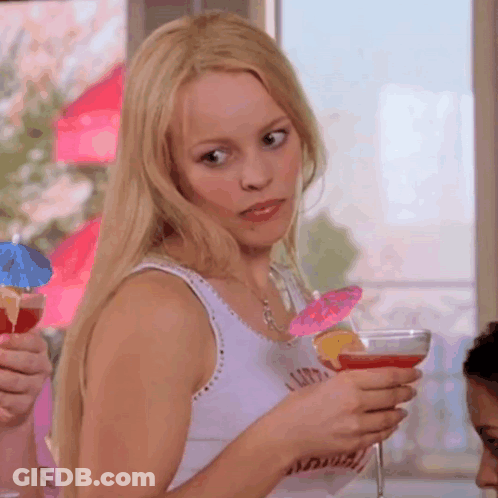 Woman Holding Martini With Pink Umbrella GIF