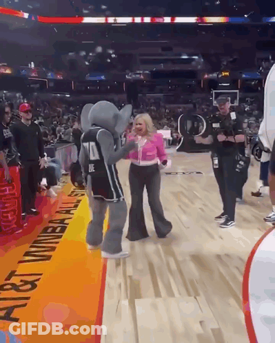Woman Holding Microphone In Front Of Scoreboard Saying Final GIF