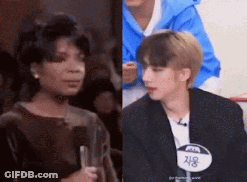 Woman Holding Microphone Next To Man In Blue Jacket GIF