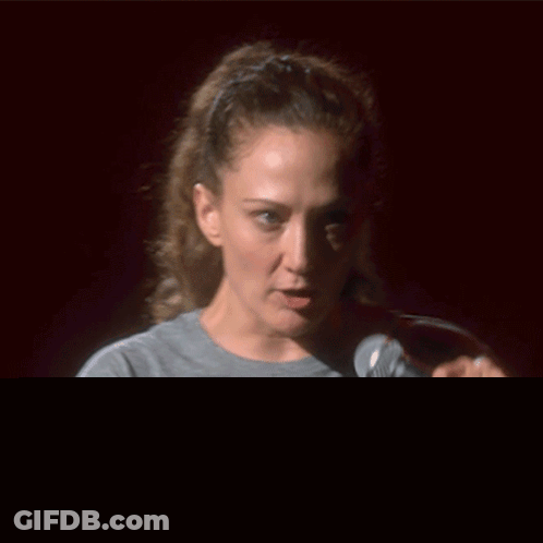 Woman Holding Microphone Saying Look At That Person GIF