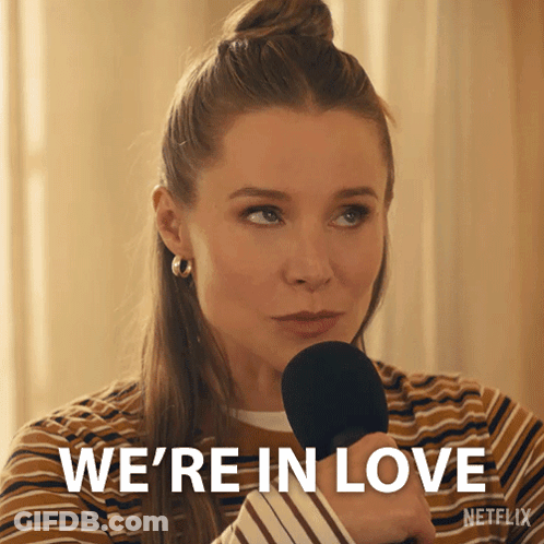 Woman Holding Microphone Saying We're In Love GIF