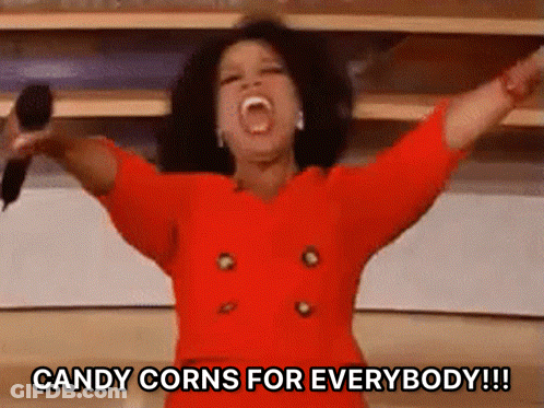 Woman Holding Microphone Says Candy Corns For Everybody GIF