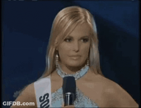 Woman Holding Microphone Wearing Sash Saying SDS GIF